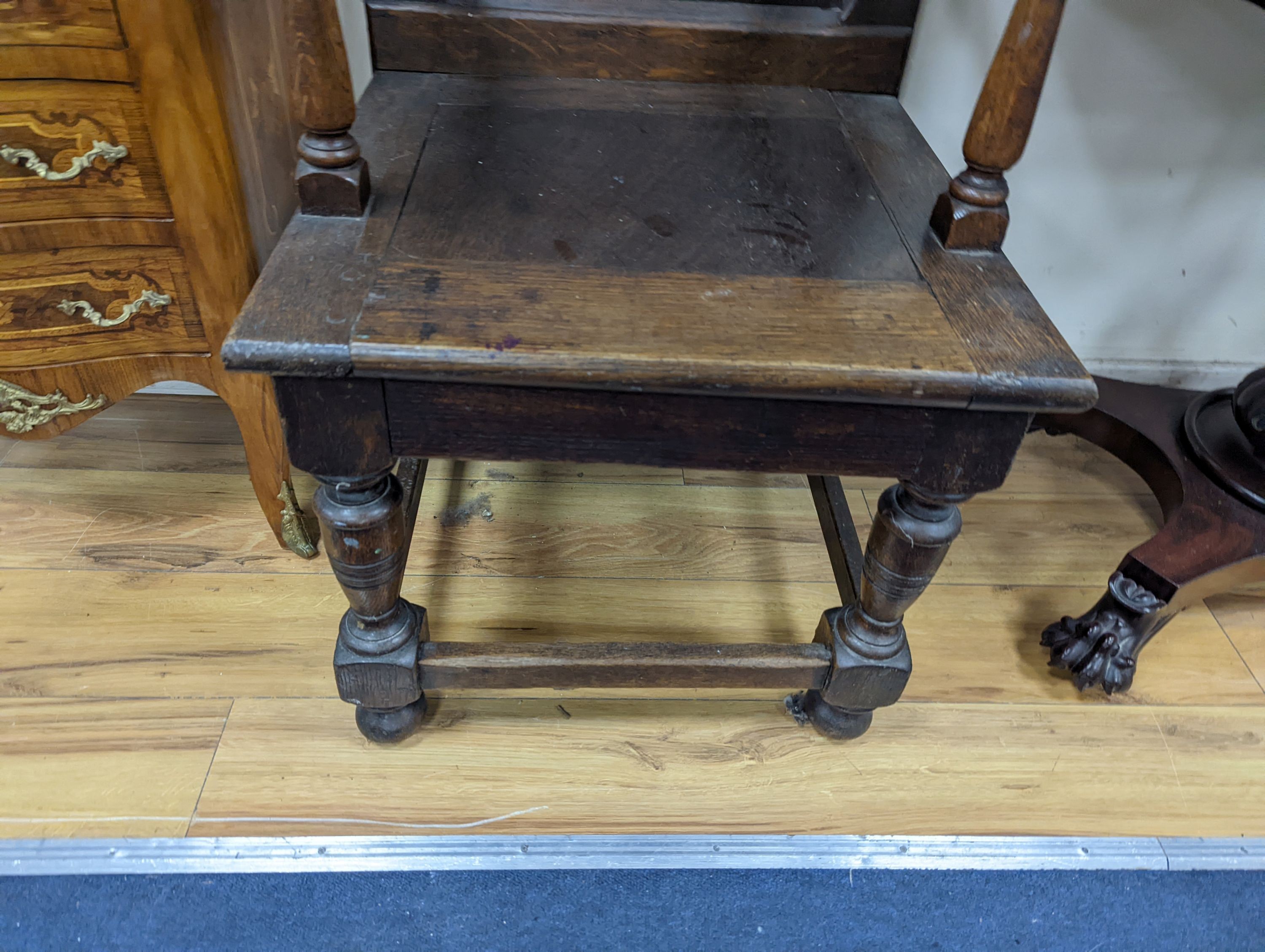 A 17th century style oak wainscot chair, width 54cm, height 122cm